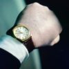Reorders wait on a person. A buyer who wants more of a style has to email and wait, even when stock is sitting there. a close up of a person wearing a watch